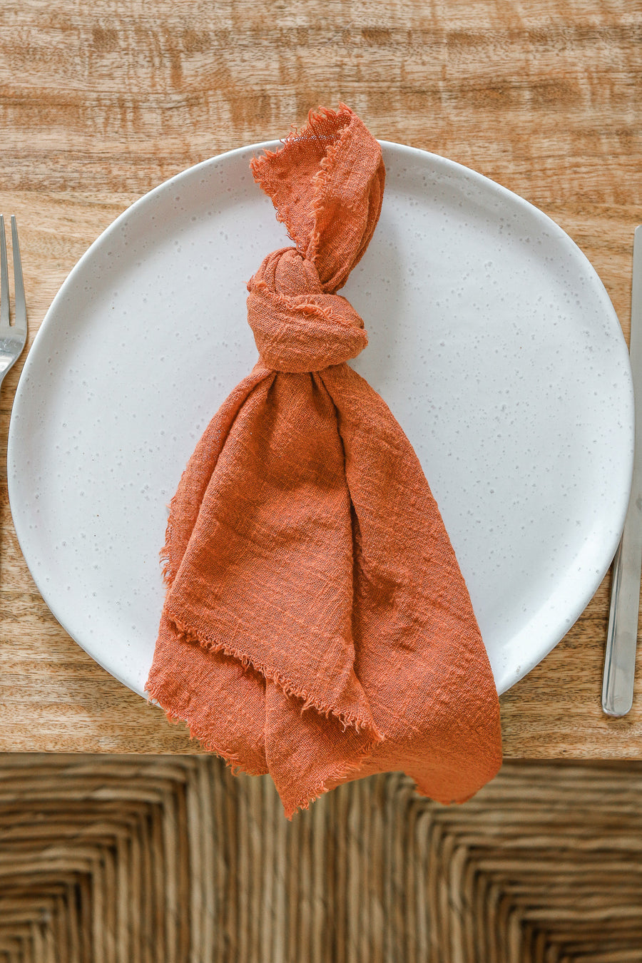 burnt orange frayed napkin