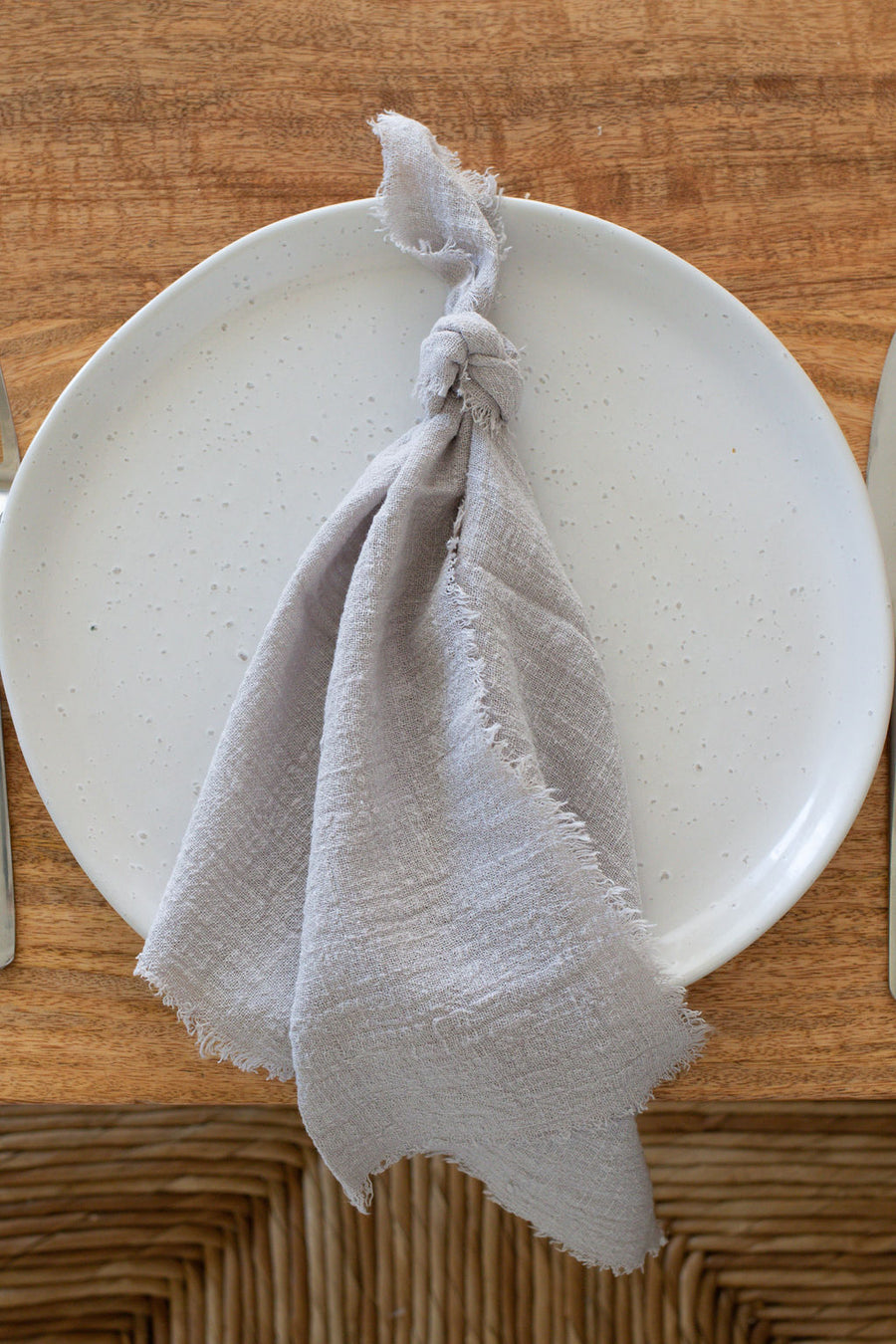 light grey frayed napkin
